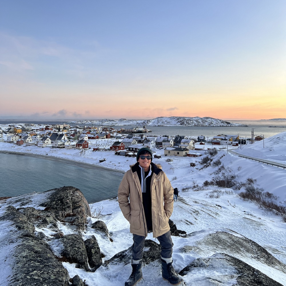 student standing on ice in Norway