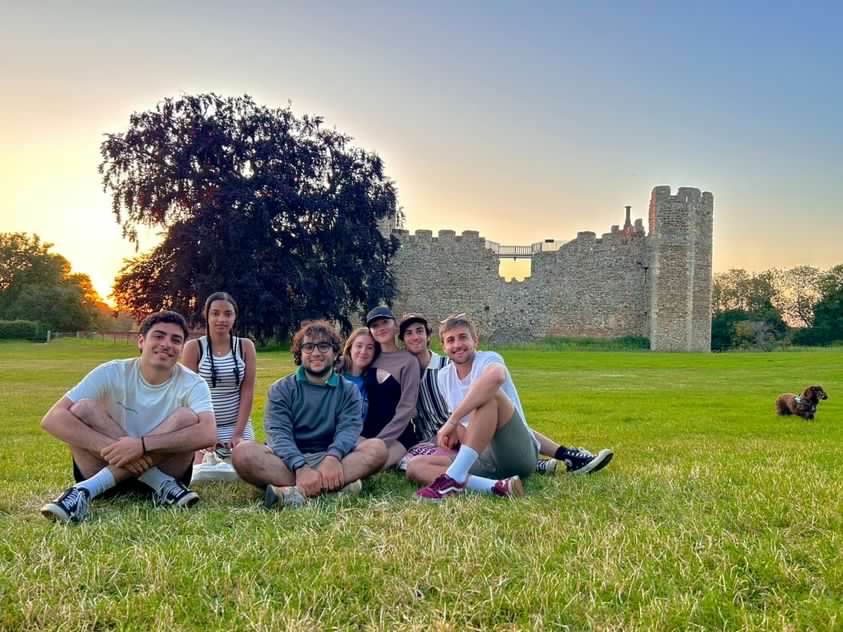 group of students sitting in park