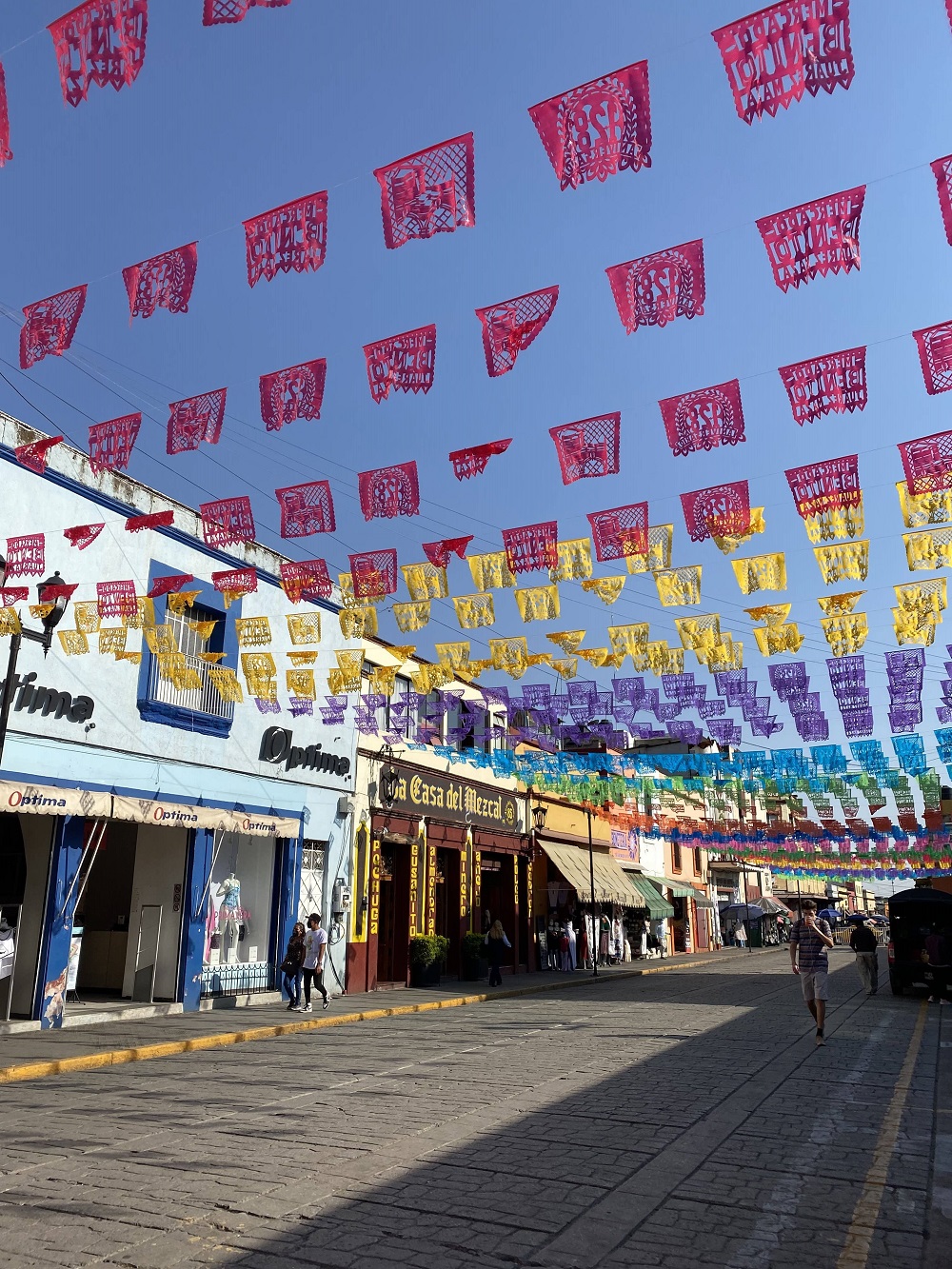 A street in Oaxaca decorated with typical Mexican flags