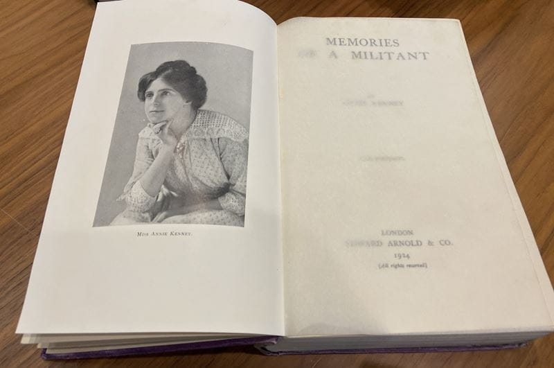 Inside cover of an old book with black and white photograph of Annie Kenney, "Memories of a Militant" - by Annie Kenney