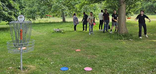 Students playing disc golf