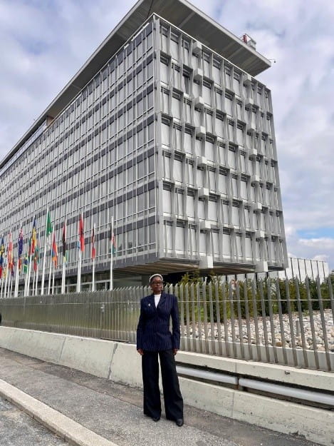 Doofan Udendeh standing outside the WHO building in Geneva.