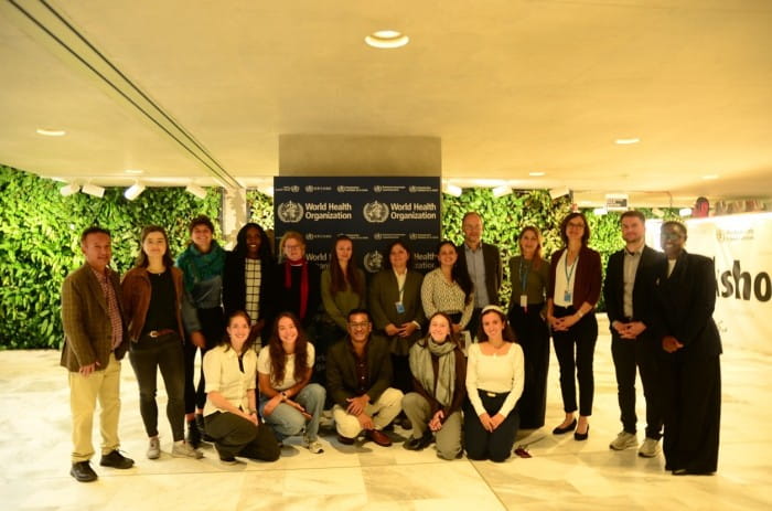 Photo of a group of men and women taken in the WHO headquarters.