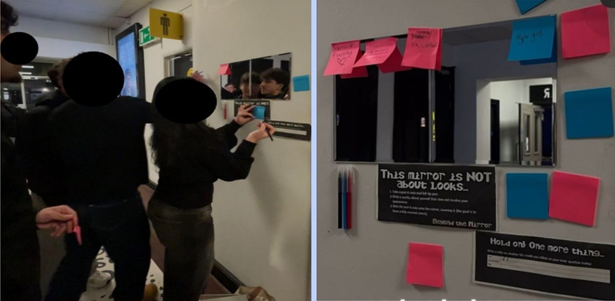 Sticky notes being placed on a wall