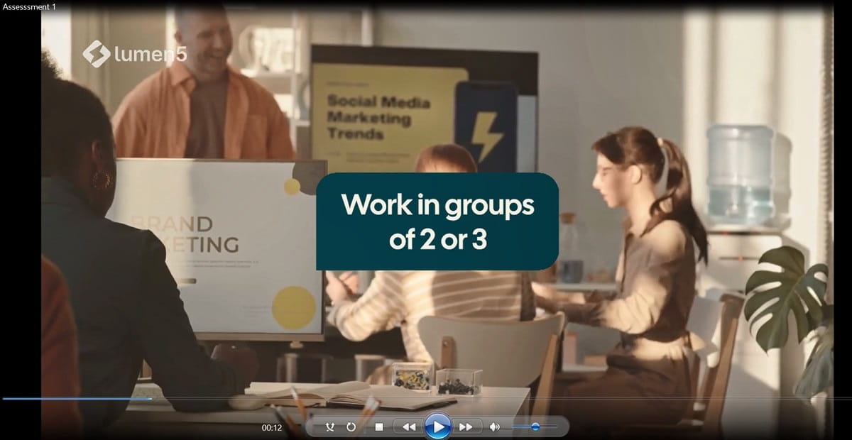 Group of people having a meeting with text overlay "work in groups of two or three"