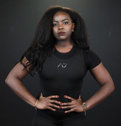 University of Essex sports scholar and powerlifter Moanne Zolario standing with hands on hip facing the camera