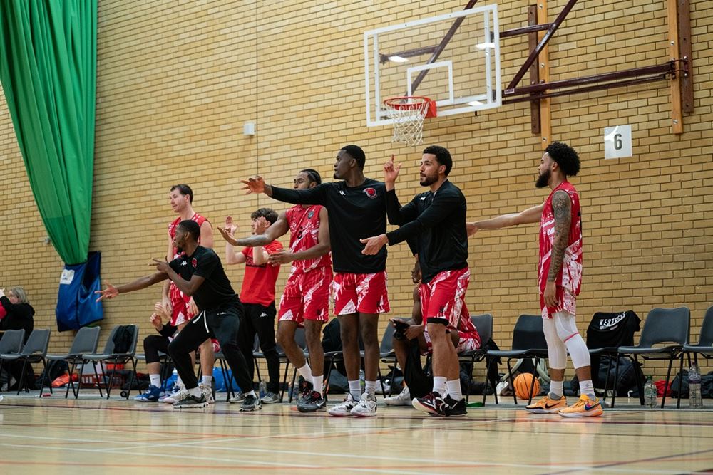 BUCS mens basketball team shouting support mid game