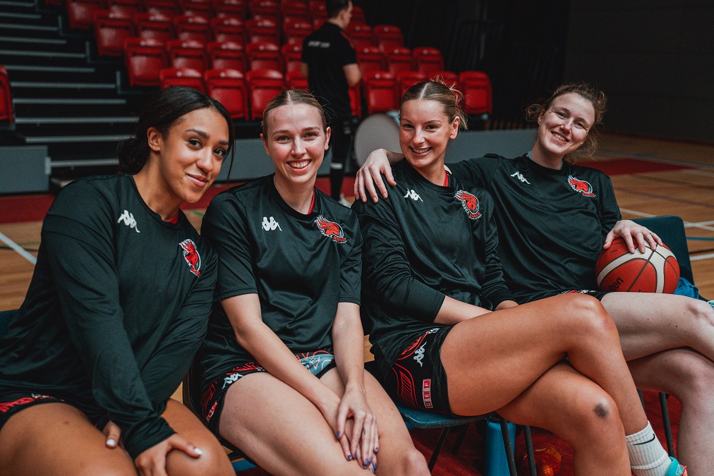 Jade Tia Cam and Claire smiling courtside Essex Rebels and BUCS womens basketball team 