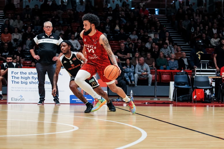 Essex Rebels game featuring Kyron Martin in action with basketball on gameday