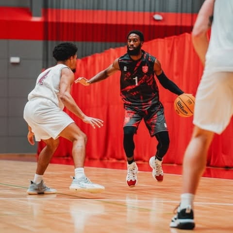 University of Essex men's 1st team basketballer Journey Shank in game action at Essex Sport Arena looking for a way around an opponent on court