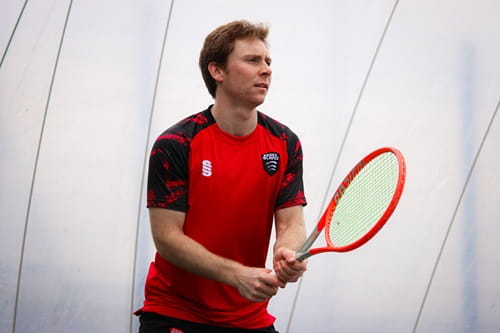 University of Essex tennis scholar Maxwell Acri playing tennis for Essex Blades in BUCS university competition in the all weather tennis dome