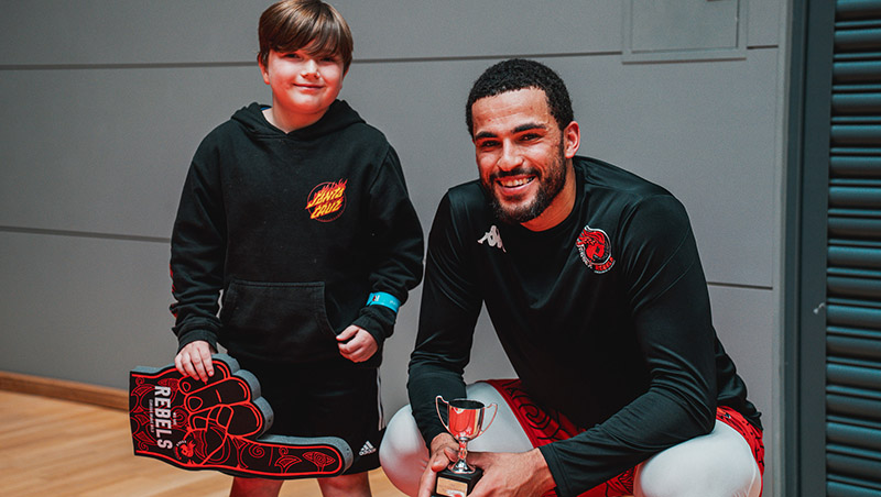 Luke Busumbru with player of the game trophy