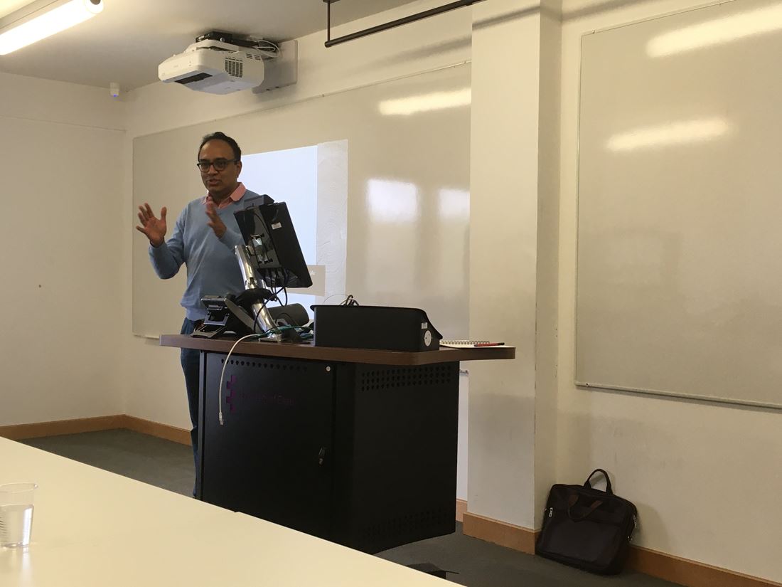 Professor Thankom Arun giving a speech in a classroom.