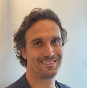 Vasilis Sarafidis smiling at the camera.