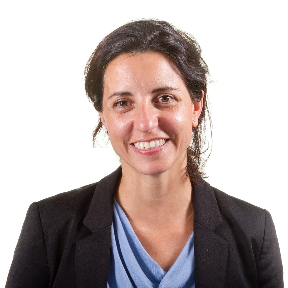Professor Mariachiara DeCesare smiling at the camera with a plain white background.