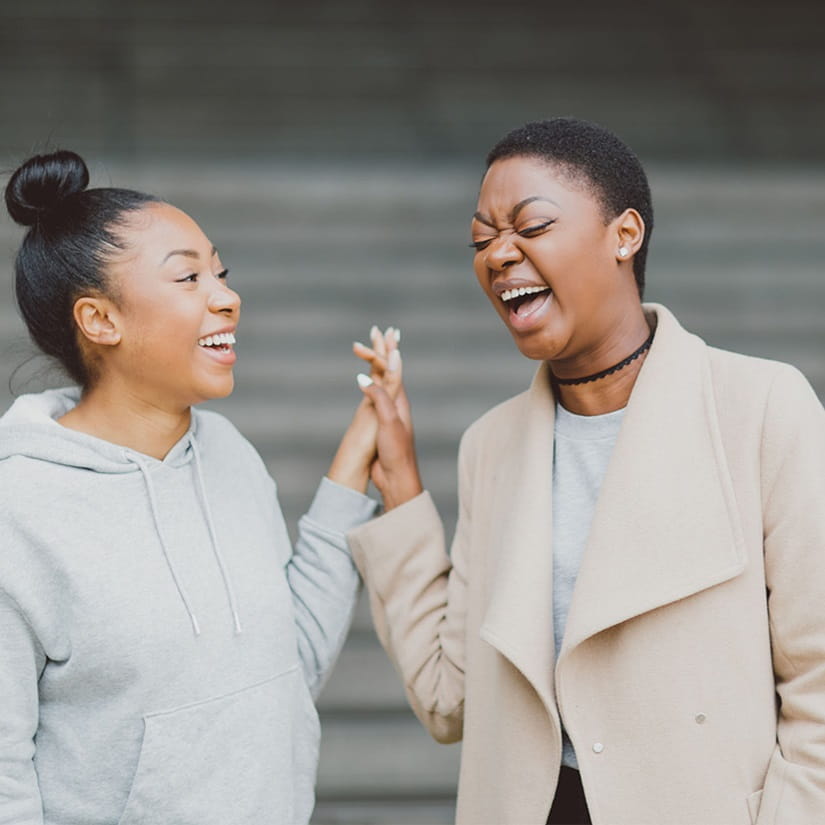 Two Clearing students at the University of Essex laughing.
