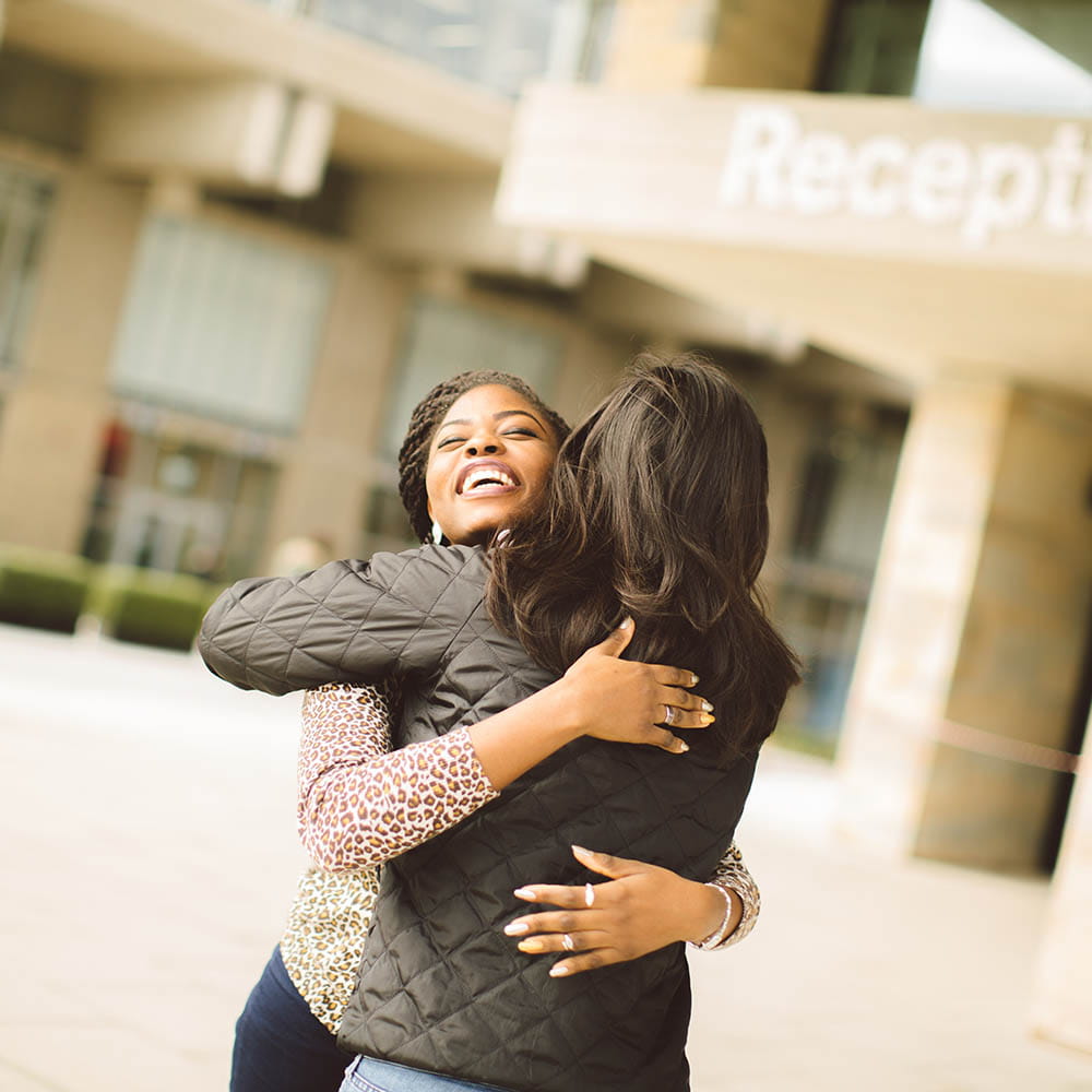 parent hugging student