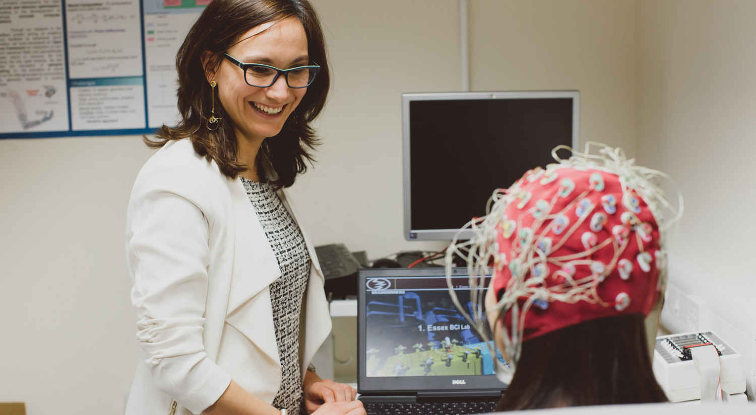 A member of staff working closely on a research project with a student