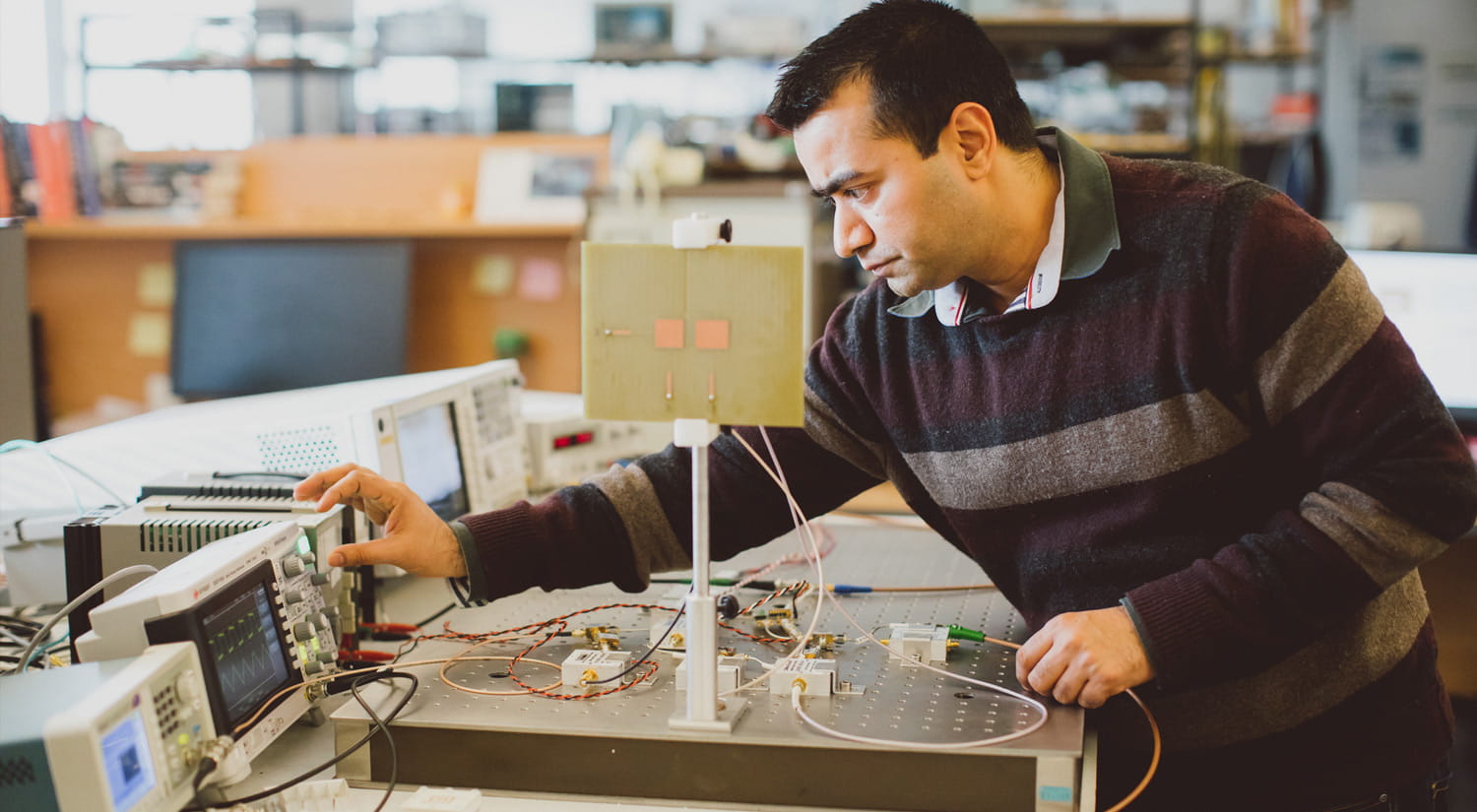 Image of a member of staff working in a lab