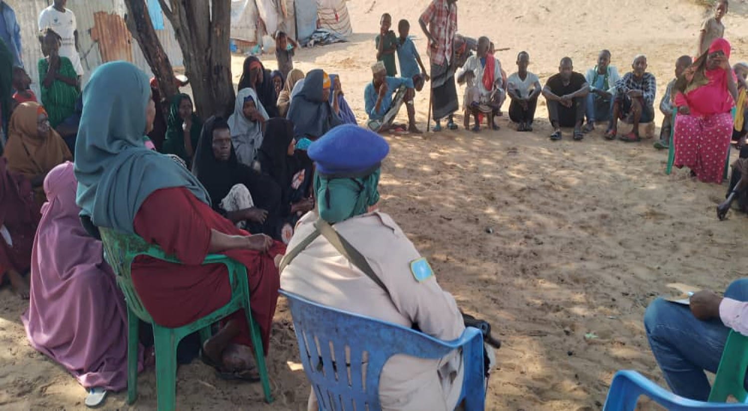 Somalian residents, families and children, gathered in a circle