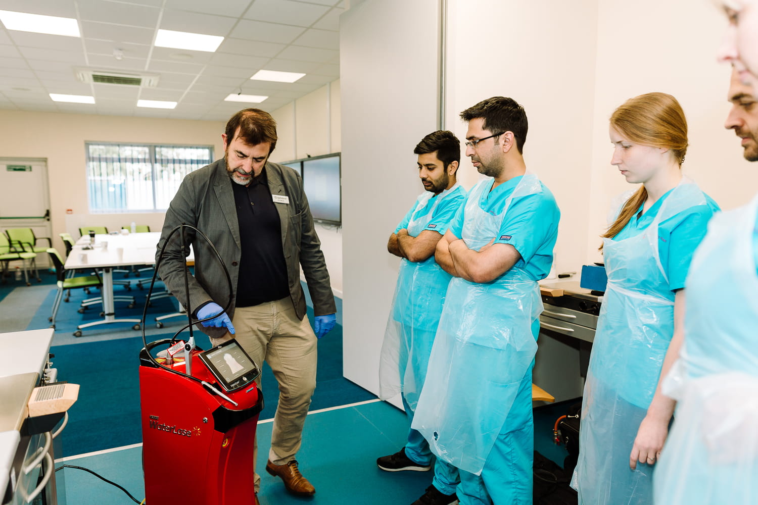Students learning how to use a Waterlase