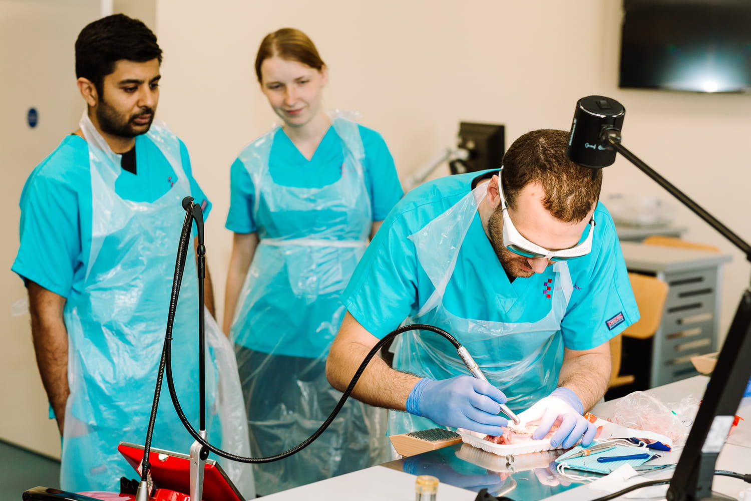 Students using a Waterlase to clean teeth