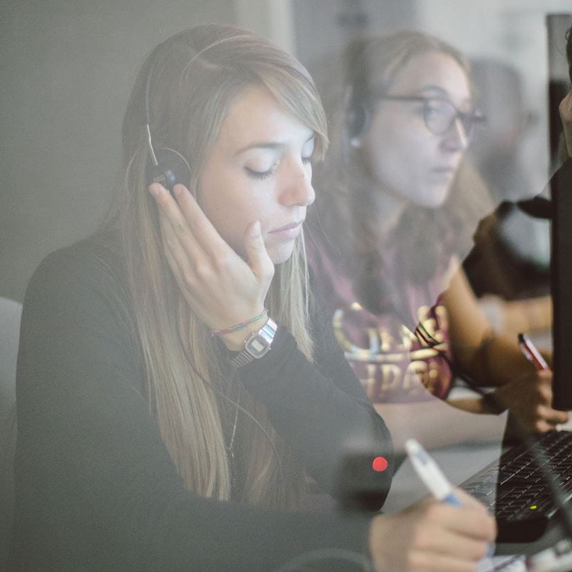 A student listening in a translation booth