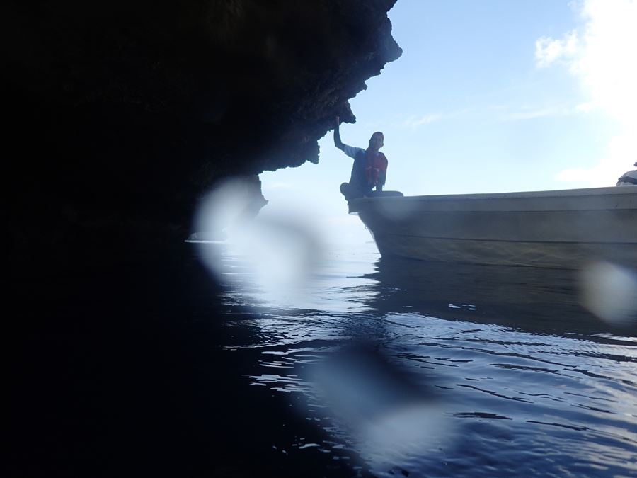 boat approaching cave
