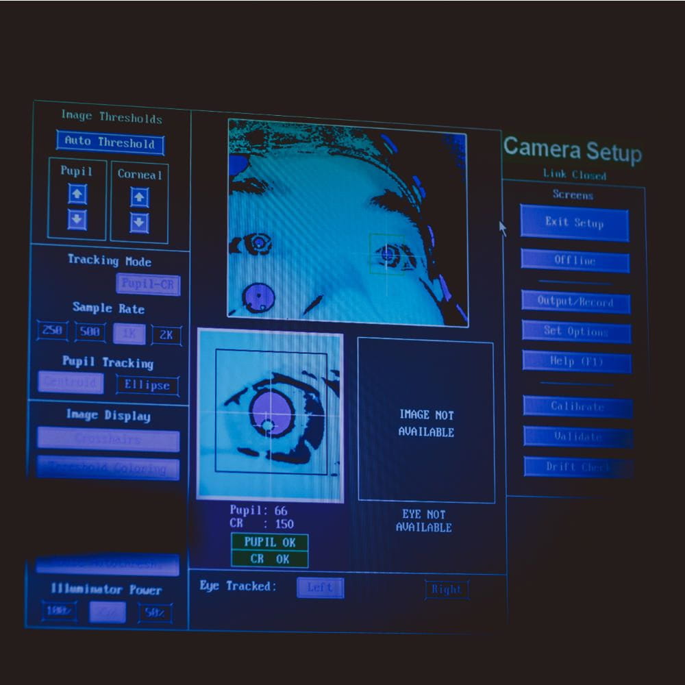 A computer screen showing a persons eye, with tracking information around it.
