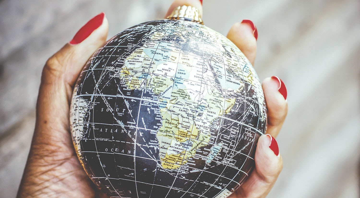 Model of the globe being held in someone's hand