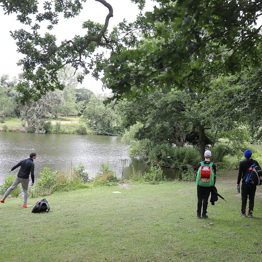 Tournament disc golf players competing