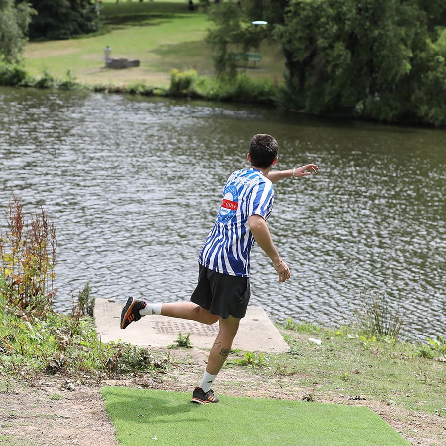 Tournament disc golf players competing