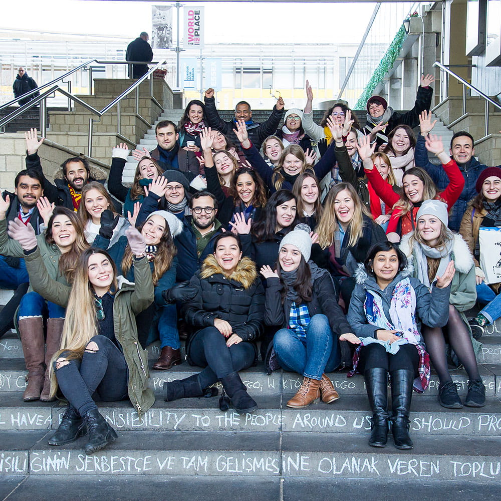 Students sitting on steps at the University of Essex