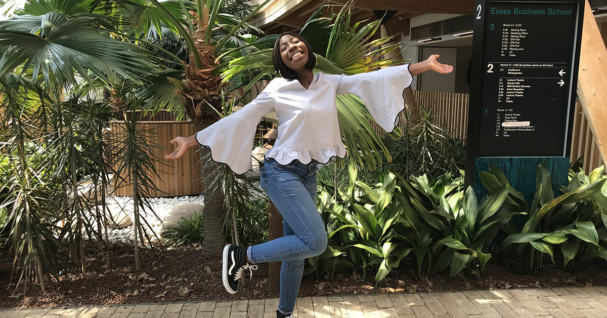 BSc Accounting and Management student Debbie Yeboa strikes a pose in the Essex Business School Winter Garden.