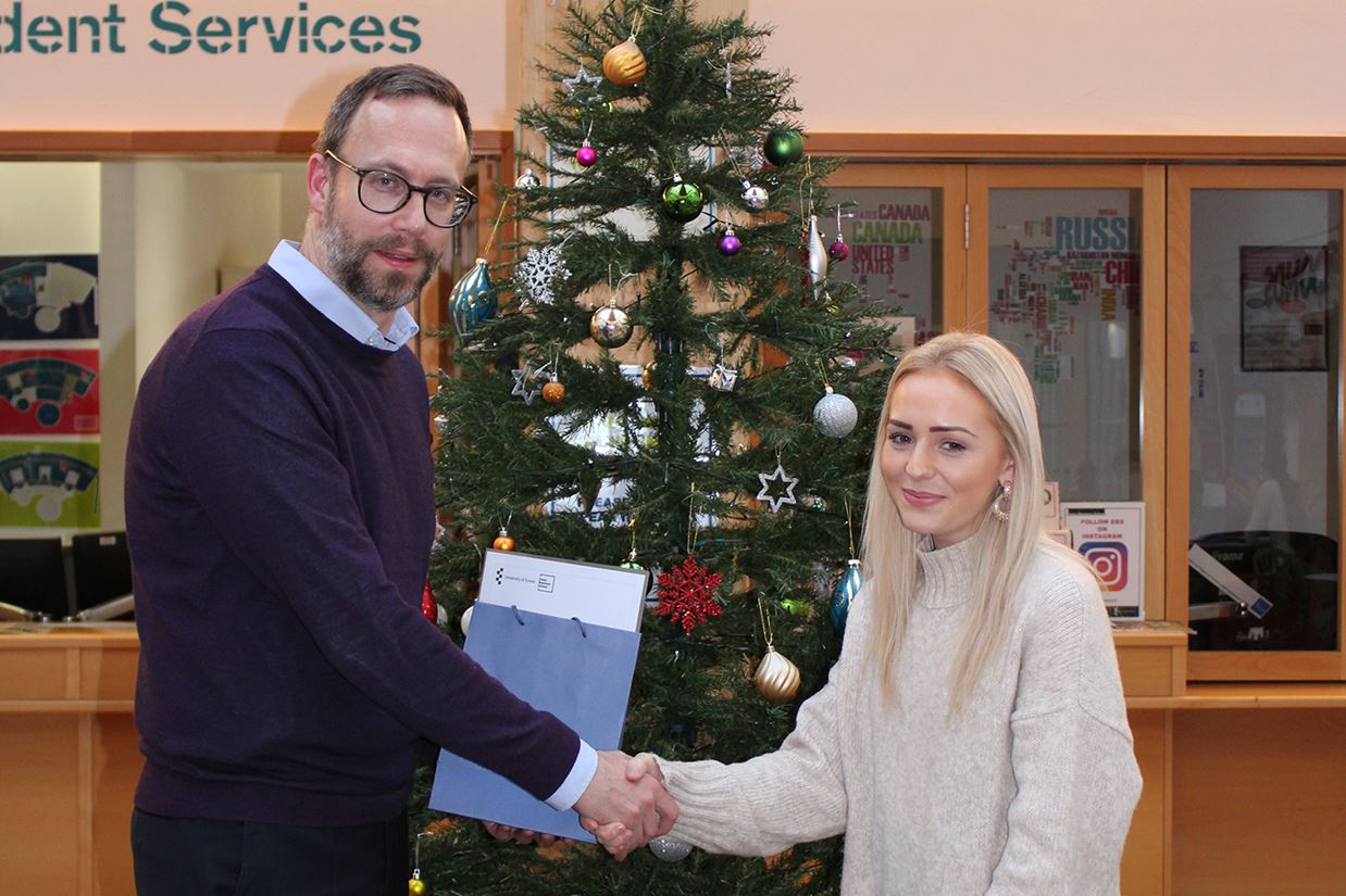 Acting Dean of Essex Business School, Professor Neil Kellard, presents the Pearson Prize to Eleanor Bennett.