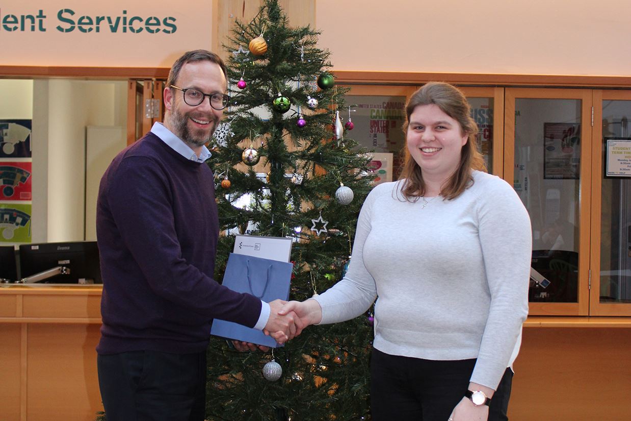 Acting Dean of Essex Business School, Professor Neil Kellard, presents the Pearson Prize to Lauren McClure.