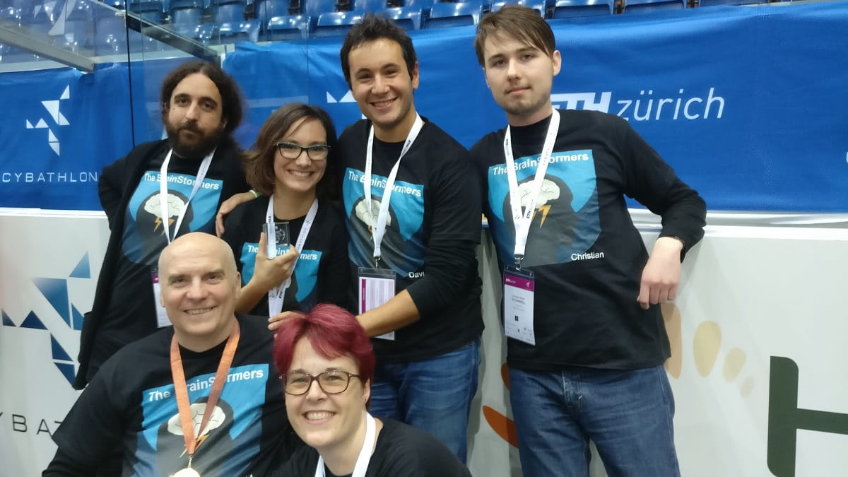 Members of the BCI lab at the Cybathlon competition in Switzerland.)