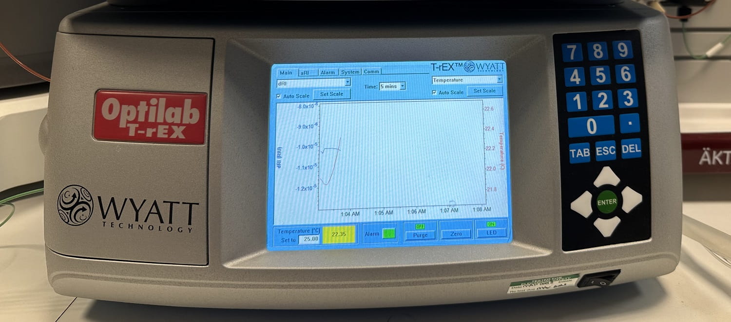 The Optilab T-rEX Refractive Index Detector, a large white plastic rectangular box with a display screen in the middle and blue numbered buttons on the right.