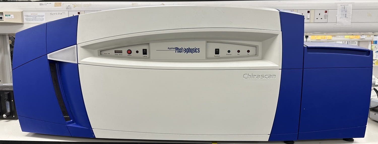 The Chirascan spectrometer, a large rectangular white and blue plastic box, with buttons in a recessed section in the middle.