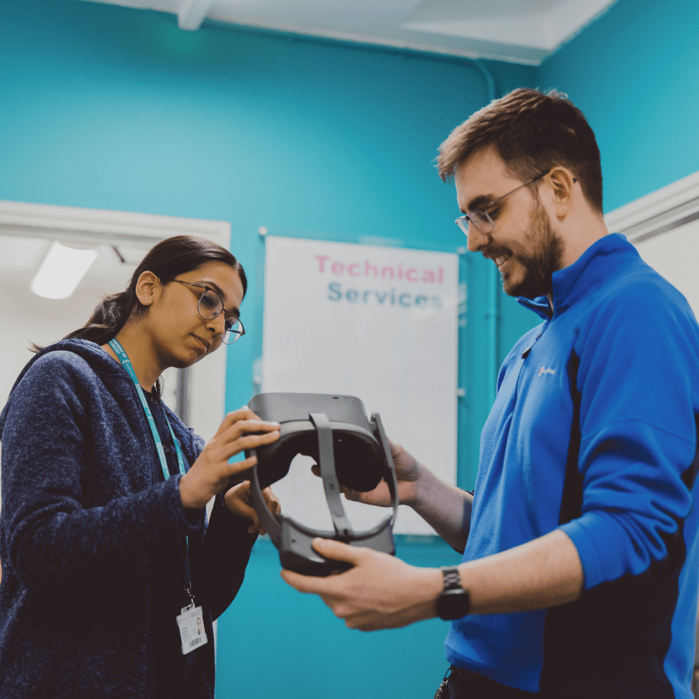 A psychology student and technician with a VR headset