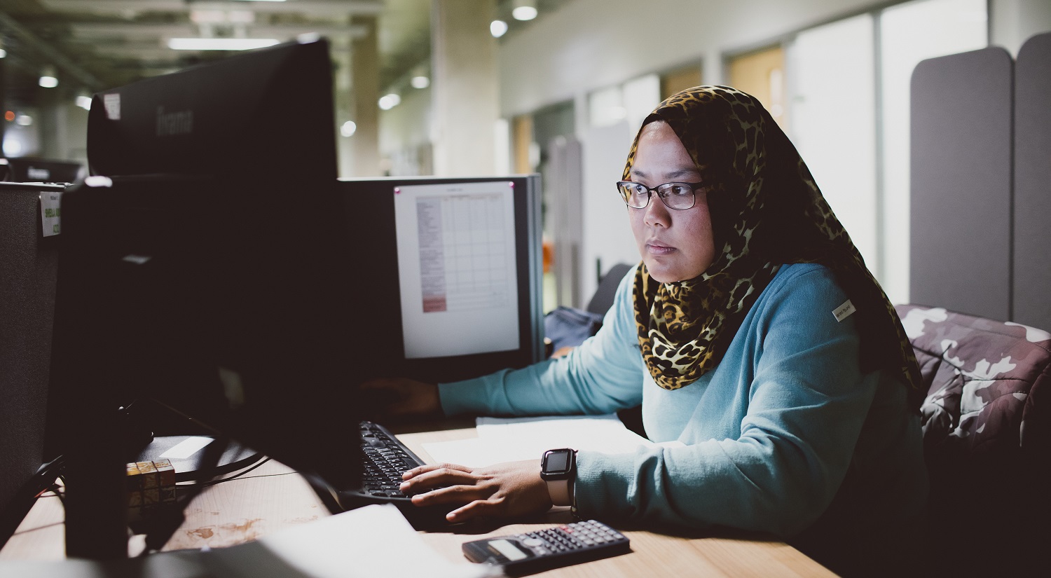 Student working at a computer in the Maths department.