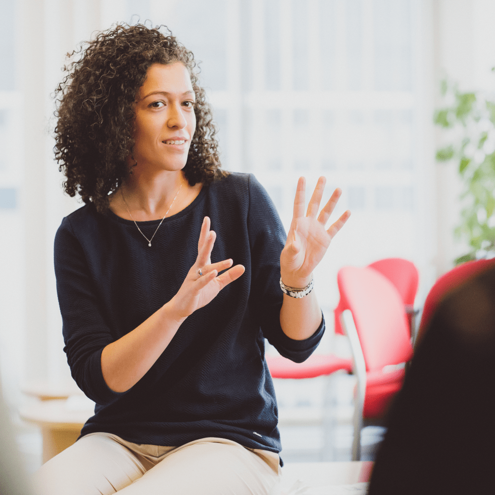 A woman talking to a group