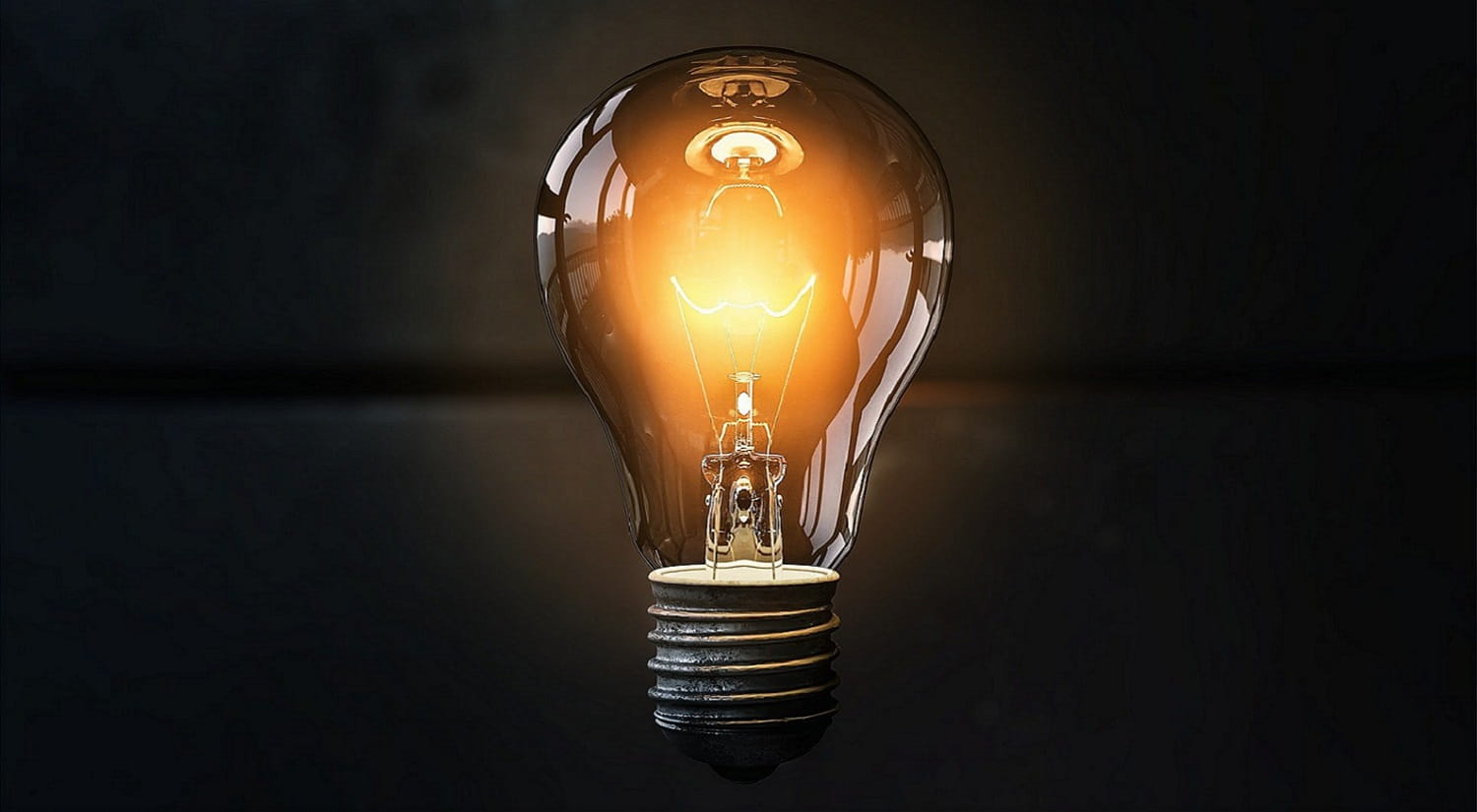 A light bulb against a dark backdrop, representing ideas and innovation.