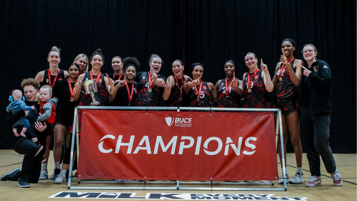 Champions: the basketball stars and staff enjoy the moment)