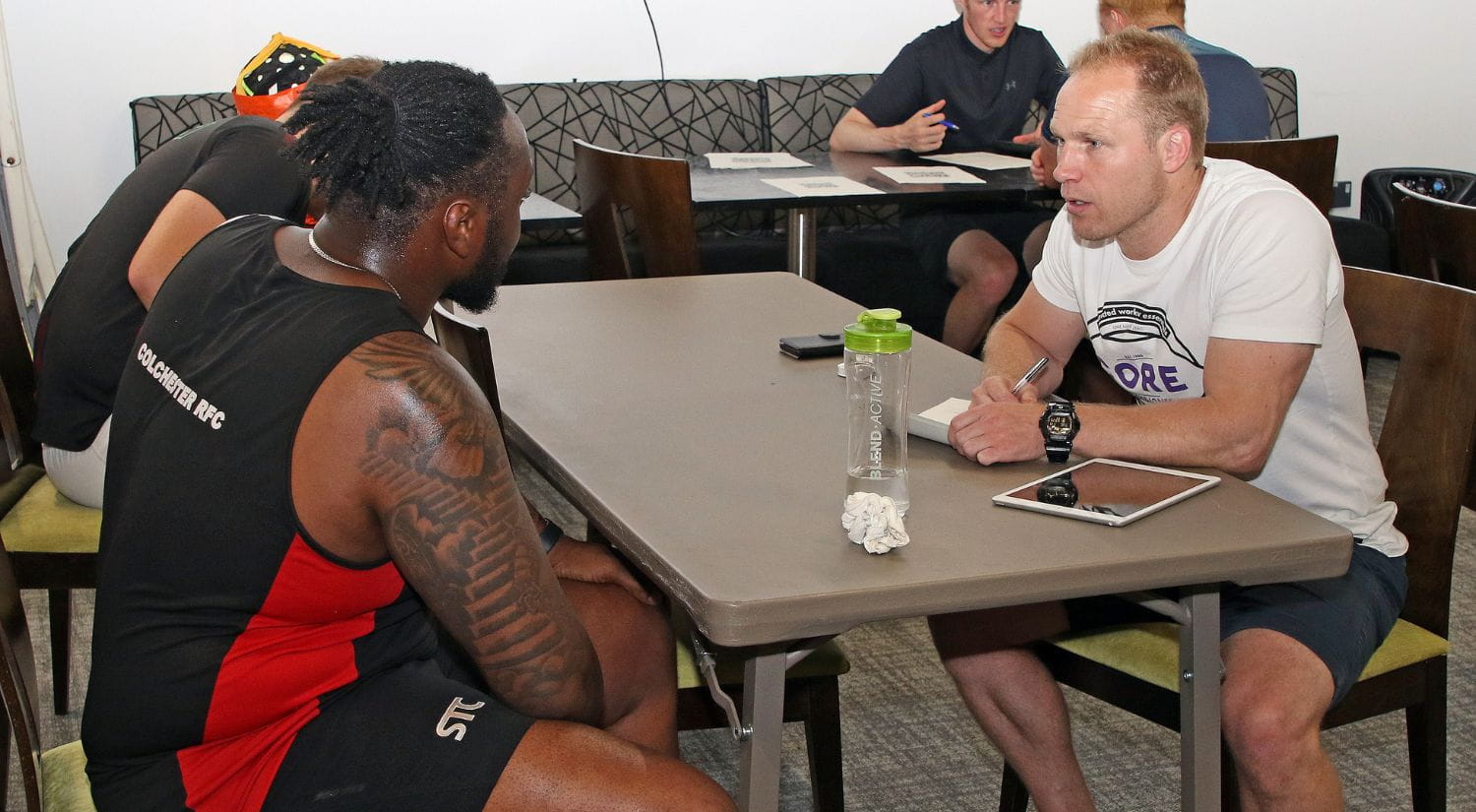 Dr Ben Jones interviews a player in pre-season