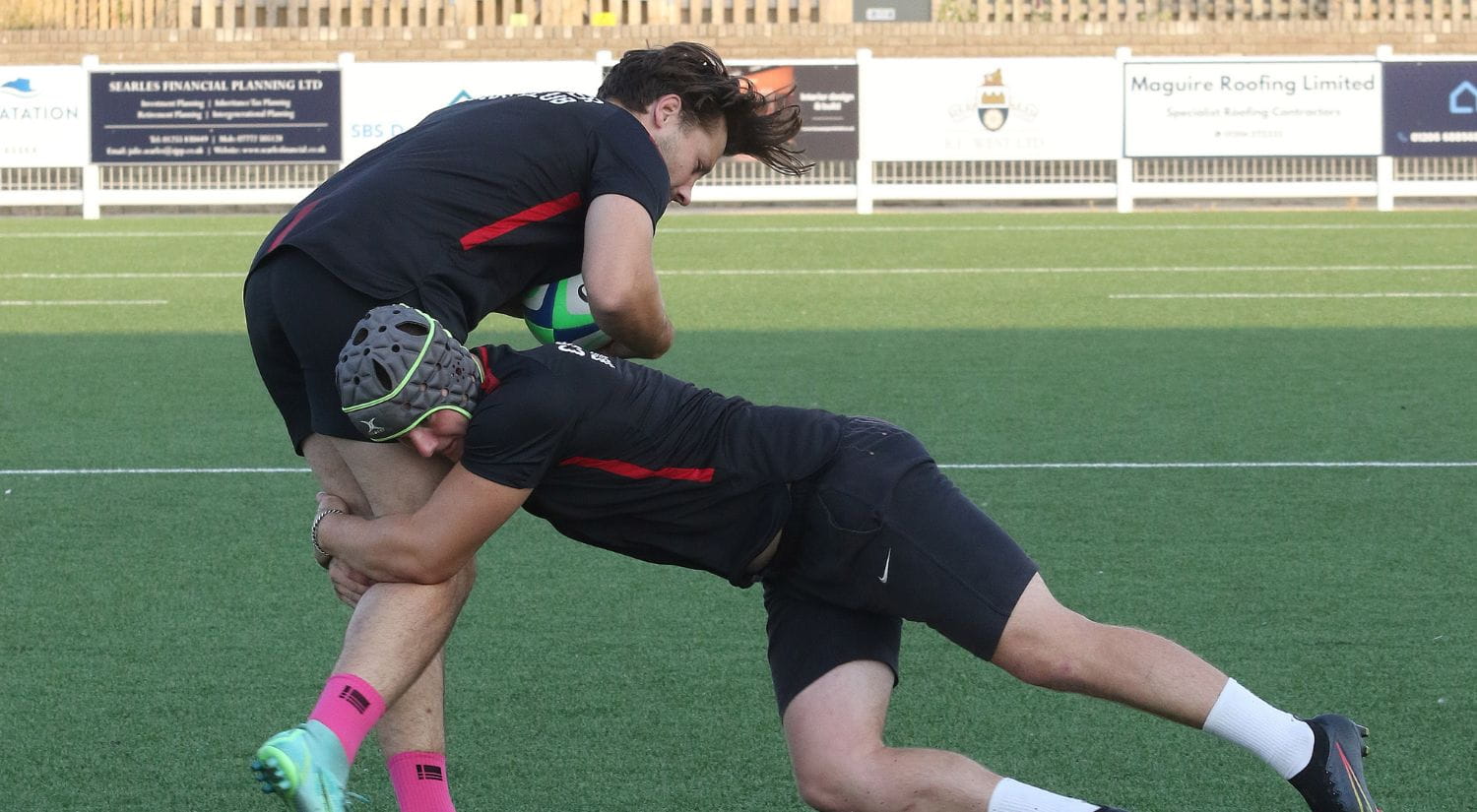 A player is tackled in training