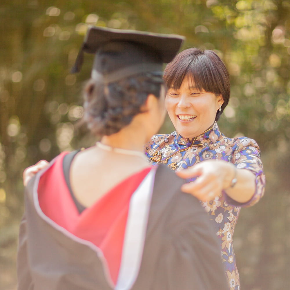 Student at graduation with her family