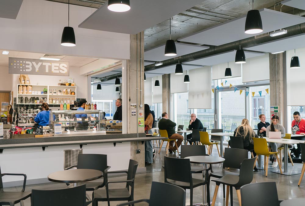 Staff and students eating, drinking and studying at our Bytes café located at the STEM Centre