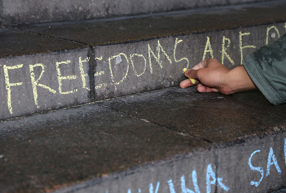 Human Rights chalking of the university steps)