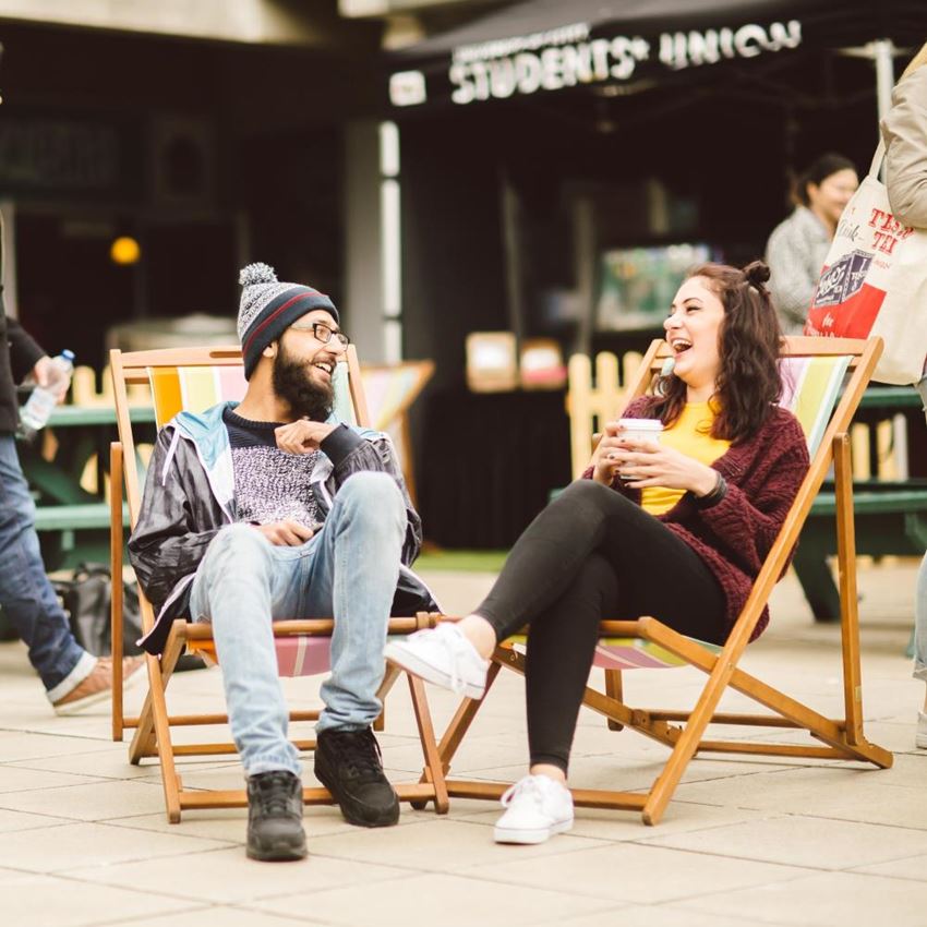 Two students chatting at an open day